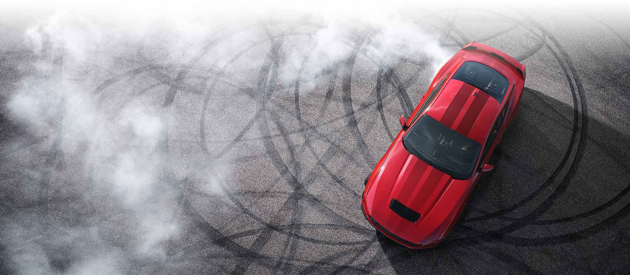 Overhead view of a 2024 Ford Mustang® model with tire tracks on pavement | Freedom Ford Greenville by Ed Morse in Greenville TX